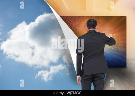 Composite image of asian businessman pointing Stock Photo