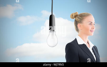 Composite image of blonde businesswoman holding tablet Stock Photo