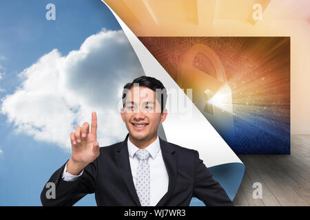 Composite image of smiling asian businessman pointing Stock Photo