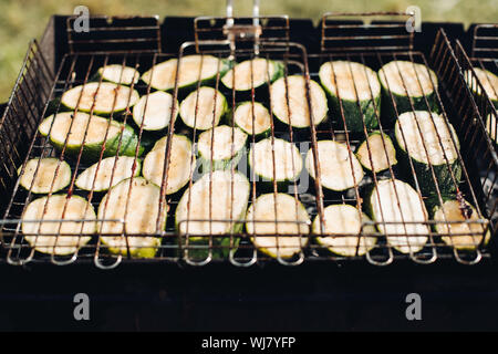 Cabbage on grill.Close-up of raw sliced squash being grilled on outdoors grill equipment. Stock Photo