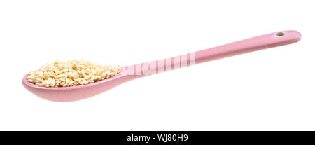side view of ceramic spoon with white sesame seeds cut out on white background Stock Photo