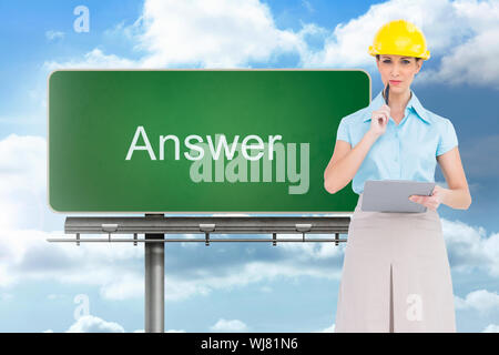 Composite image of thoughtful attractive architect on white background holding clipboard Stock Photo