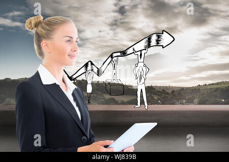 Composite image of blonde businesswoman holding tablet Stock Photo