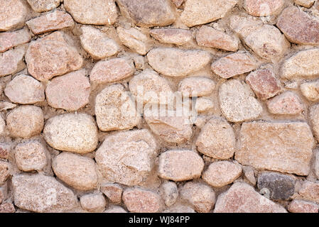 Masonry wall of stones, pattern texture background Stock Photo