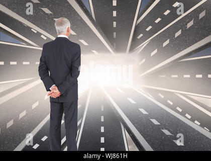 Composite image of rear view of mature businessman posing Stock Photo