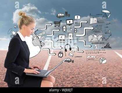 Composite image of blonde businesswoman using laptop Stock Photo