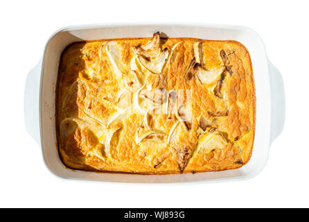 french cuisine - top view of baked omelette with white squash vegetable in ceramic baking dish cutout on white background Stock Photo