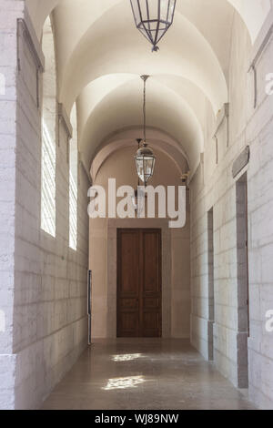 Arches and lobby of the cloister in a medieval monastery in Lyon, France, with its typical stone and marble architecture during a sunny day  Picture o Stock Photo