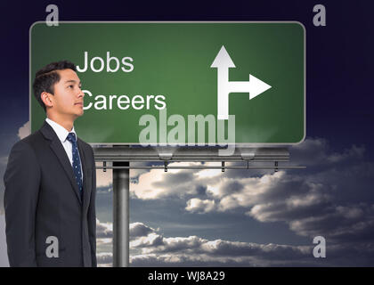 Composite image of signpost showing the direction of jobs and careers with sky in the background Stock Photo