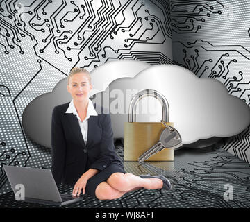 Composite image of blonde businesswoman using laptop Stock Photo