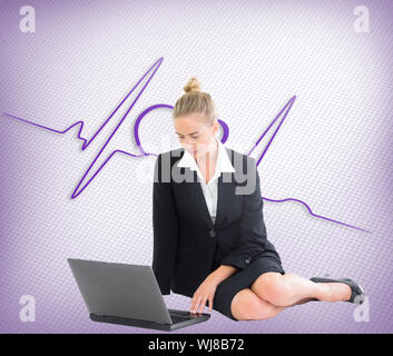 Composite image of blonde businesswoman using laptop Stock Photo