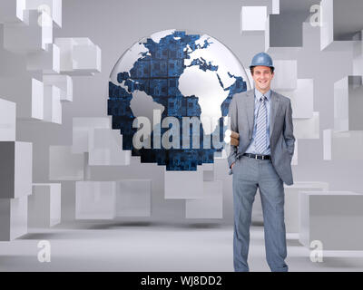 Composite image of smiling attractive architect on phone holding plans Stock Photo