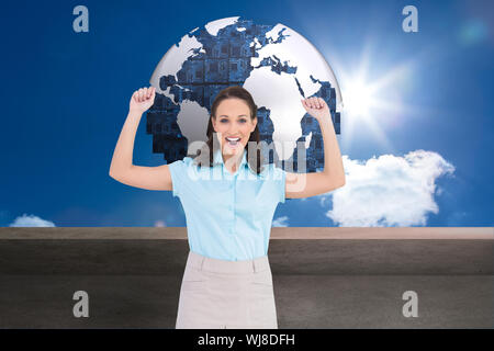 Composite image of victorious stylish businesswoman posing Stock Photo