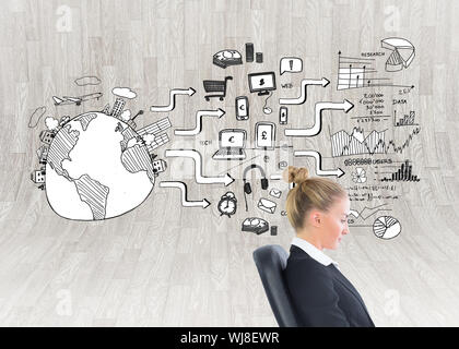 Composite image of blonde businesswoman sitting on swivel chair with laptop Stock Photo