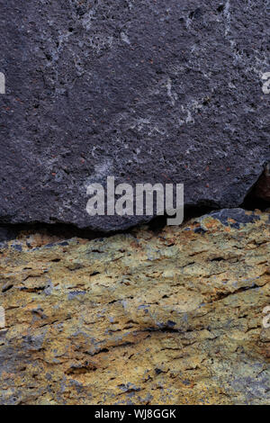 Yellow and grey rocks together close view, part of a wall texture Stock Photo
