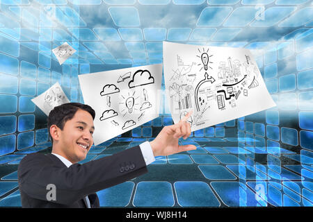 Composite image of smiling asian businessman pointing Stock Photo
