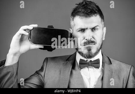 use future technology. Digital future and innovation. virtual reality goggles. Modern business. bearded man wear wireless VR glasses. businessman in VR headset. Visual reality. Using VR technologies. Stock Photo