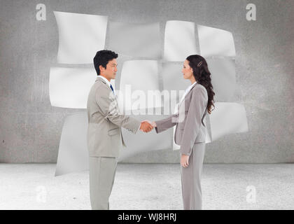 Composite image of side view of hand shaking trading partners Stock Photo