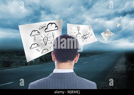 Composite image of businessman standing Stock Photo