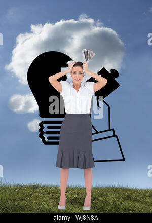 Composite image of worried stylish businesswoman holding newspaper Stock Photo