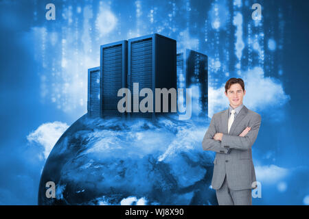 Composite image of assertive businessman standing in front of the camera Stock Photo
