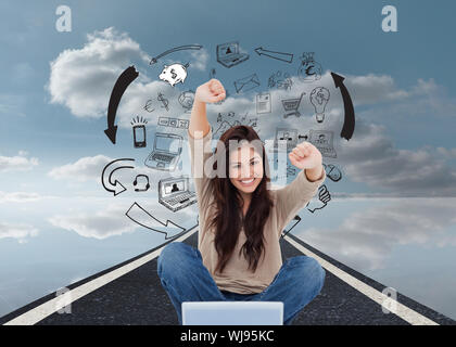 Composite image of a woman celebrating in front of her laptop as she smiles looking forward. Stock Photo