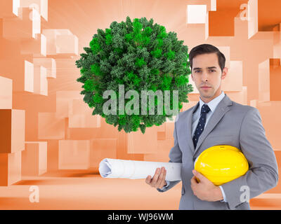 Composite image of serious architect holding plans and hard hat Stock Photo