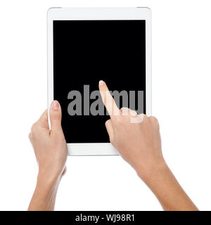 Womans finger pointing on tablet screen Stock Photo