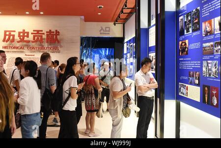 (190903) -- BEIJING, Sept. 3, 2019 (Xinhua) -- People visit an exhibition on John Rabe at the Museum of the War of Chinese People's Resistance Against Japanese Aggression in Beijing, capital of China, Sept. 3, 2019. The exhibition, which opened Tuesday in Beijing, recast 30 years of life experience of the German businessman in China, who helped protect Chinese citizens during the 1937 Nanjing Massacre. A total of 151 historical photos are on display at the exhibition, which consists of four parts with details from the Rabe family, his life in China and his contribution to Sino-German relations Stock Photo