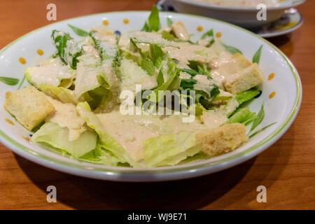 Green leafy salad with croutons in a plate Stock Photo
