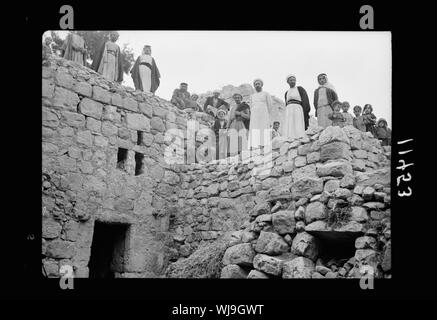 Halhul village at kilometer 30 on Hebron road. Villagers on roof of semi subterranean houses Stock Photo