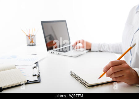 Business team two colleagues discussing new plan financial graph data on office table Stock Photo