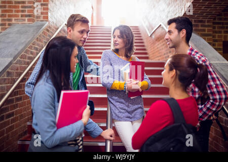 Group of young college students convering on stairs in the college Stock Photo
