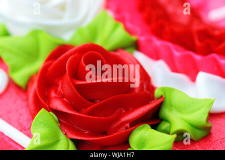Up-close rose shaped cake icing for birthday, anniversary or Valentine's Day. Stock Photo