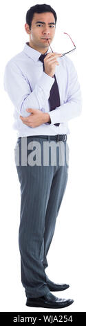 Unsmiling businessman holding glasses Stock Photo