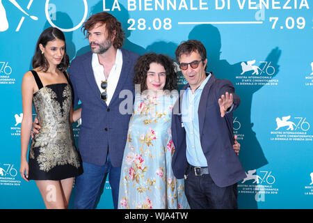 Venice, Italy. 3rd Sep, 2019. Director Atom Egoyan (1st R) and other cast members attend a photocall for the film 'Guest of Honour' during the 76th Venice Film Festival in Venice, Italy, on Sept. 3, 2019. Credit: Zhang Cheng/Xinhua/Alamy Live News Stock Photo