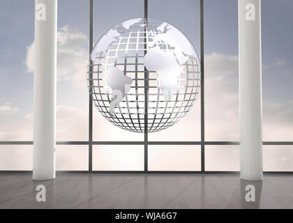 Silver globe floating in room Stock Photo