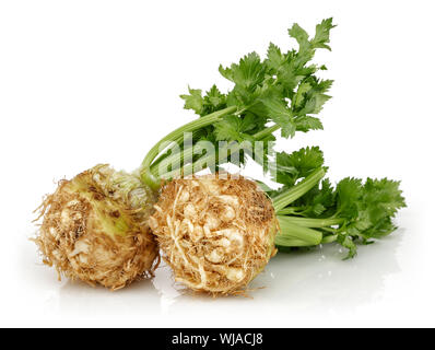 Fresh celeriac root with celery stalks isolated background Stock Photo