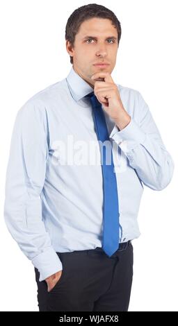 Thinking businessman touching his chin Stock Photo