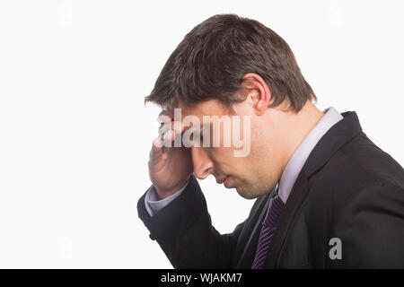 Close-up side view of a worried businessman Stock Photo