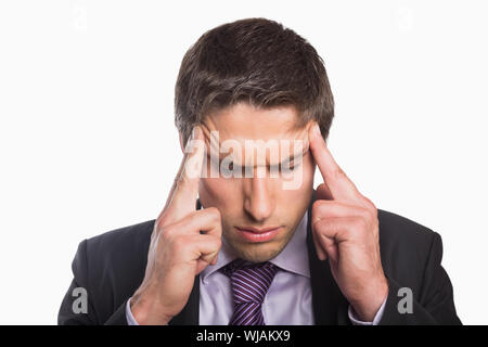 Tensed businessman suffering from headache Stock Photo