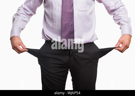 Mid section of a businessman with pockets pulled out Stock Photo