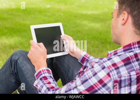 Happy student using his tablet outside Stock Photo