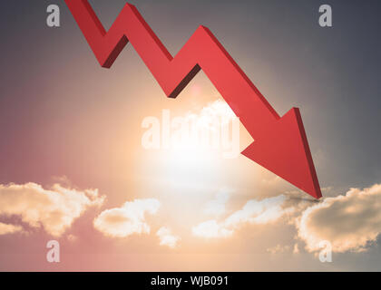Red arrow pointing down against sky Stock Photo