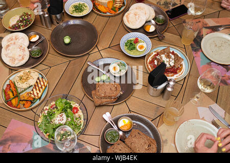 Different meals for the guests on the restaurant table. Served tablr with dishes Stock Photo