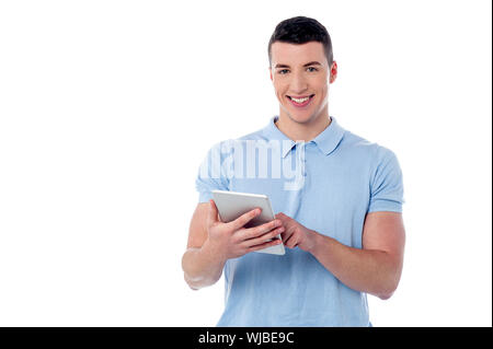Smart guy browsing on his new tablet pc Stock Photo