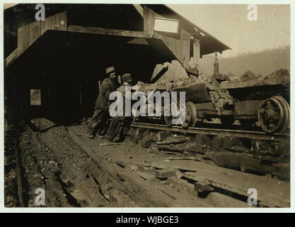 Harley Bruce, a young coupling-boy at tipple of Indian Mountain Line of Proctor Coal Co., near Jellico, Tenn. He appears to be 12 or 14 years old, and says he has been working there about a year. It is hard work and dangerous. Not many young boys employed in or about the mines of this region. Abstract: Photographs from the records of the National Child Labor Committee (U.S.) Stock Photo