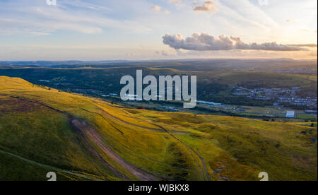 Aerial view of Gwent Welsh Valleys towns and mountains at Sunset
