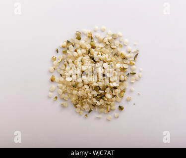 Hemp seeds piled and seen from above, closeup Stock Photo