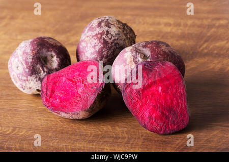fresh, raw Beetroots over wooden background. Stock Photo